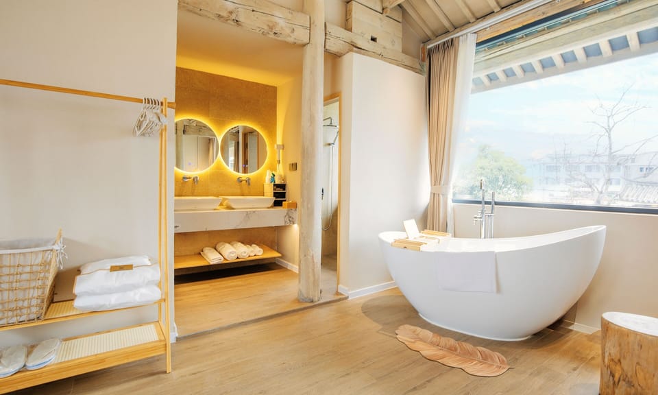 Family Studio Suite, Courtyard View | Bathroom | Shower, hair dryer, slippers, towels