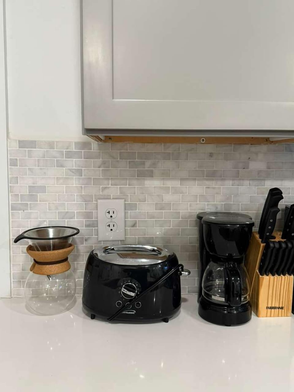 Fully equipped kitchen featuring a sleek countertop, modern appliances, and all the tools you need to prepare home-cooked meals.