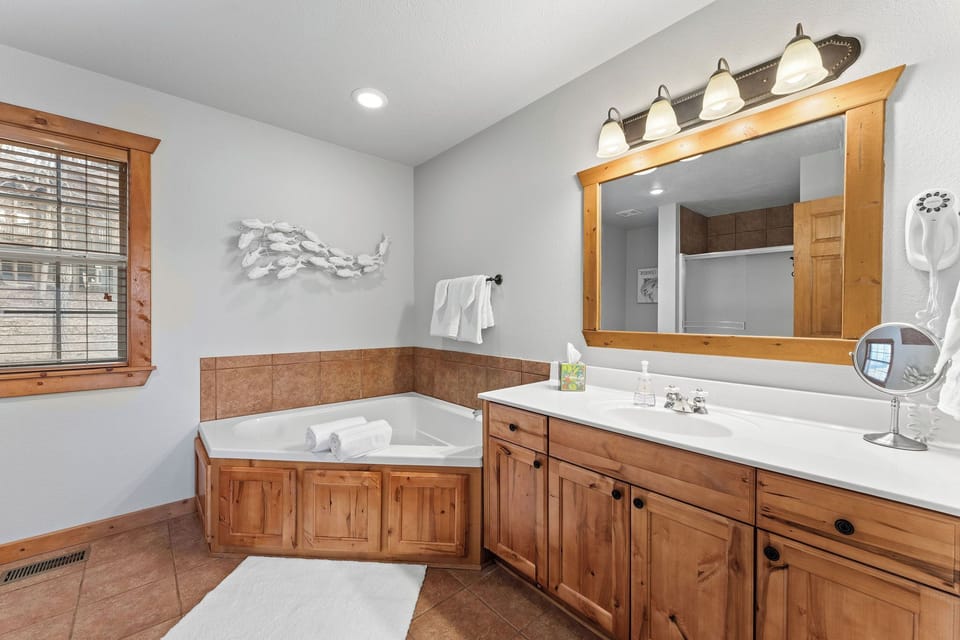 Spa-like bathroom with jetted tub and spacious vanity