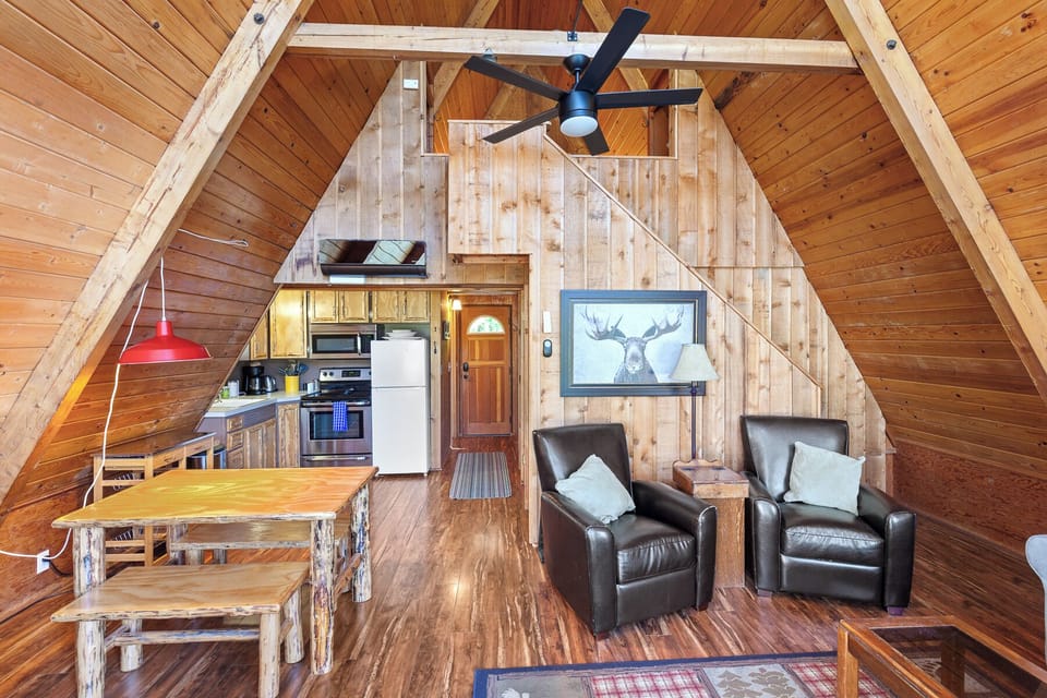 Bask in natural light, unwind by the fire, and enjoy your favorite shows in this scenic living space