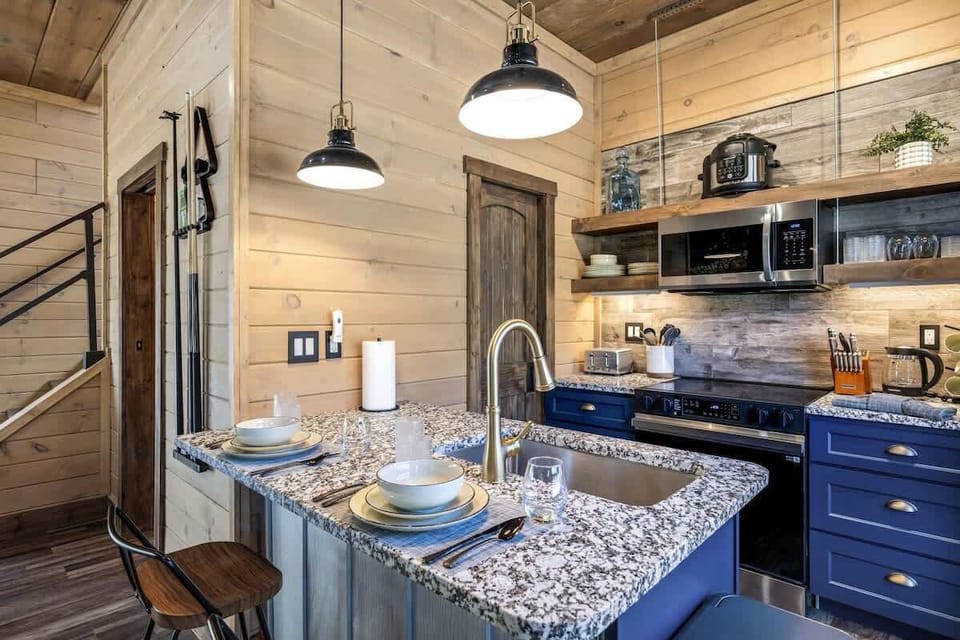 Fully stocked kitchen with modern appliances, granite counters, and everything you need to cook and dine in comfort.