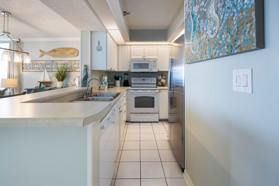 Sea Serenity at Perdido Sun Resort in Perdido Key - Galley style kitchen is fully equipped.