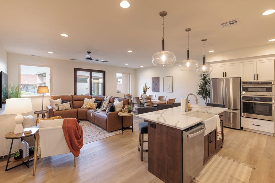 View from Entry Hallway - The living room is designed as an open floor plan and is a great gathering place for meals, games, or watching TV during your stay.