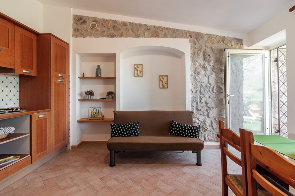 Apartment, Garden View | Living room | 32-inch flat-screen TV with digital channels