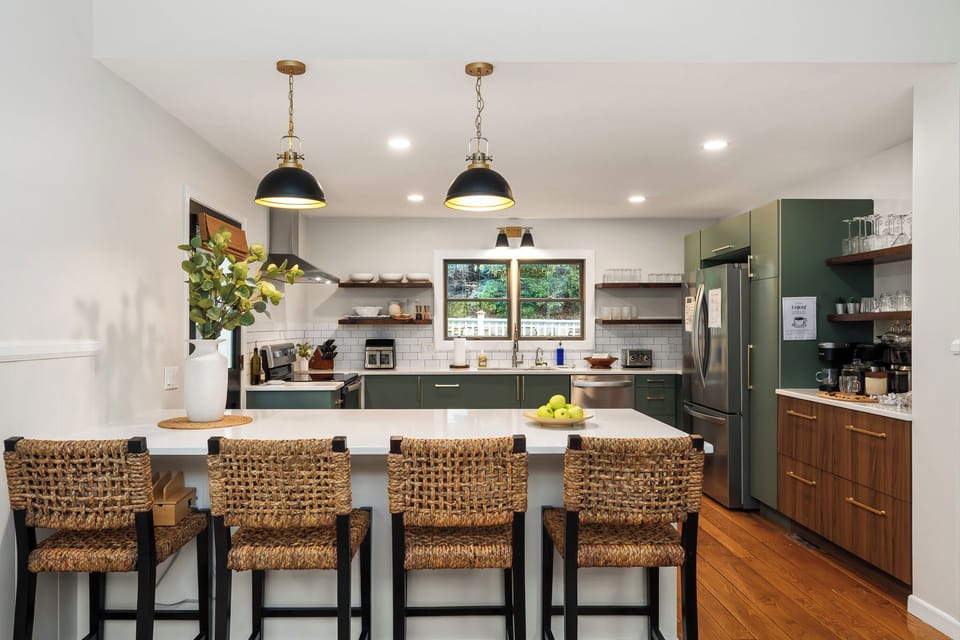 Elegant Kitchen: Sleek design with modern appliances and ample seating for culinary adventures! We have it all: air fryer, stand mixer, waffle maker, blender, and small utensils, too!