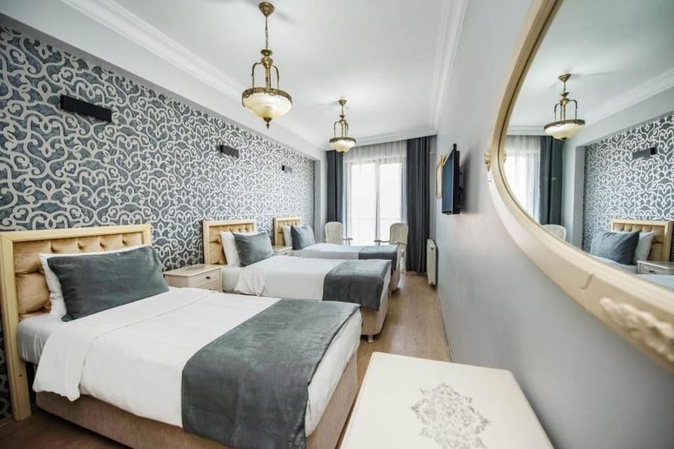 Deluxe Triple Room | Premium bedding, in-room safe, individually furnished, desk