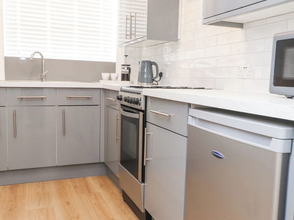 Fridge, microwave, toaster, cookware/dishes/utensils
