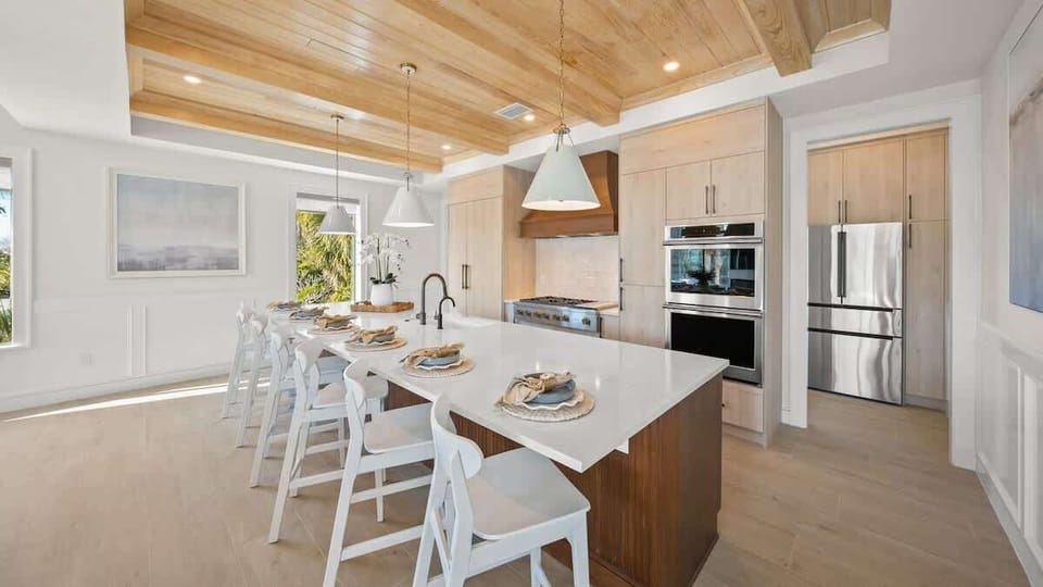 Great Room - Open Floor Plan - Fully Stocked Kitchen, Dining for 16 and Bar seating for 6 - Balcony Access