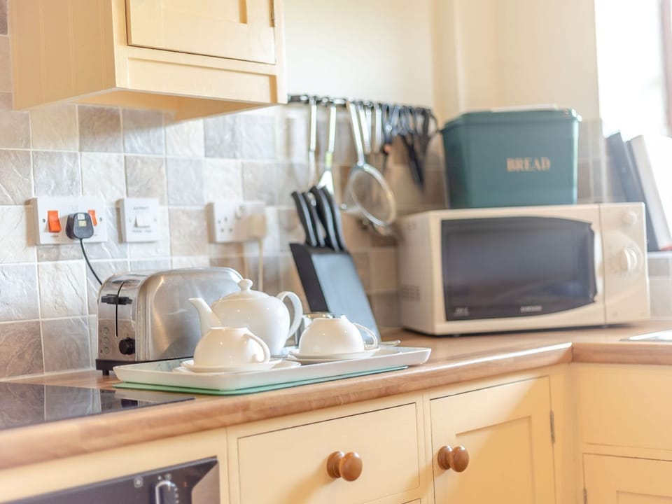 Fridge, microwave, cookware/dishes/utensils