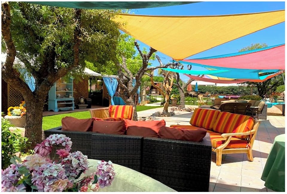 Plaza facing outdoor Art Gallery with a reception seating and Native Artifacts