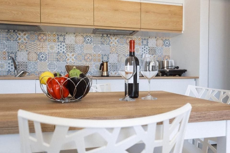 Classic Apartment, Garden View | Living area | Flat-screen TV