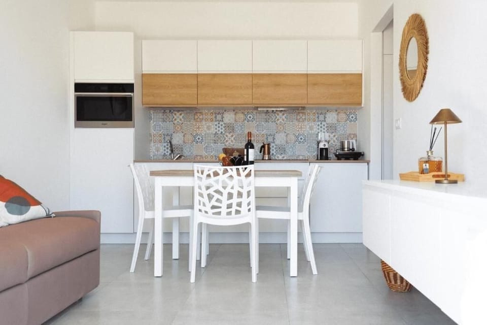 Classic Apartment, Garden View | Living area | Flat-screen TV