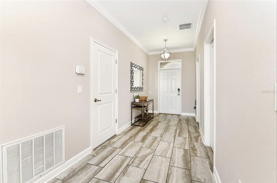 Bright, welcoming hallway with stylish wood-look floors
