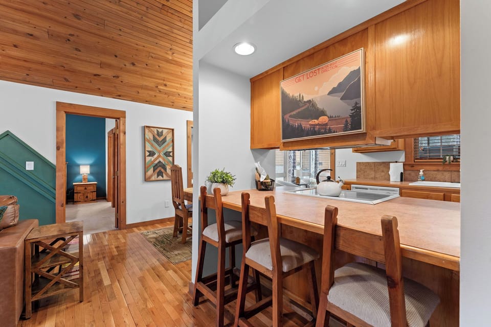 Use the kitchen bar for additional seating or enjoy a light snack.