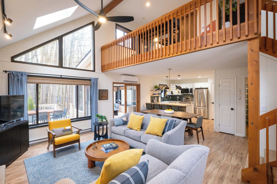 Living Room: Bright space with modern decor, soaring ceilings, and scenic views for relaxation.