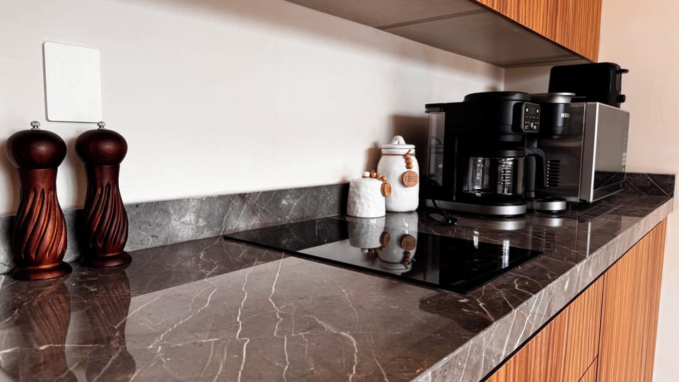 Full-size fridge, microwave, cookware/dishes/utensils
