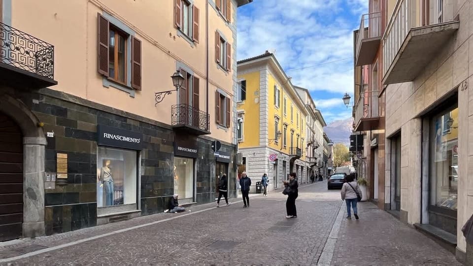 Apartment exterior, street with shops and bars