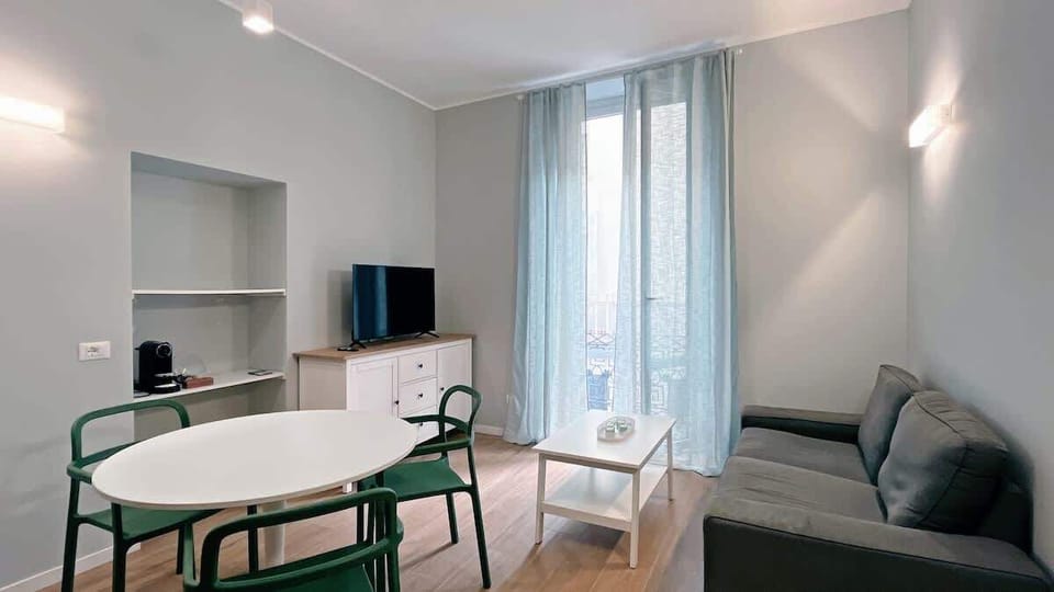 Comfortable living room with sofa and TV
