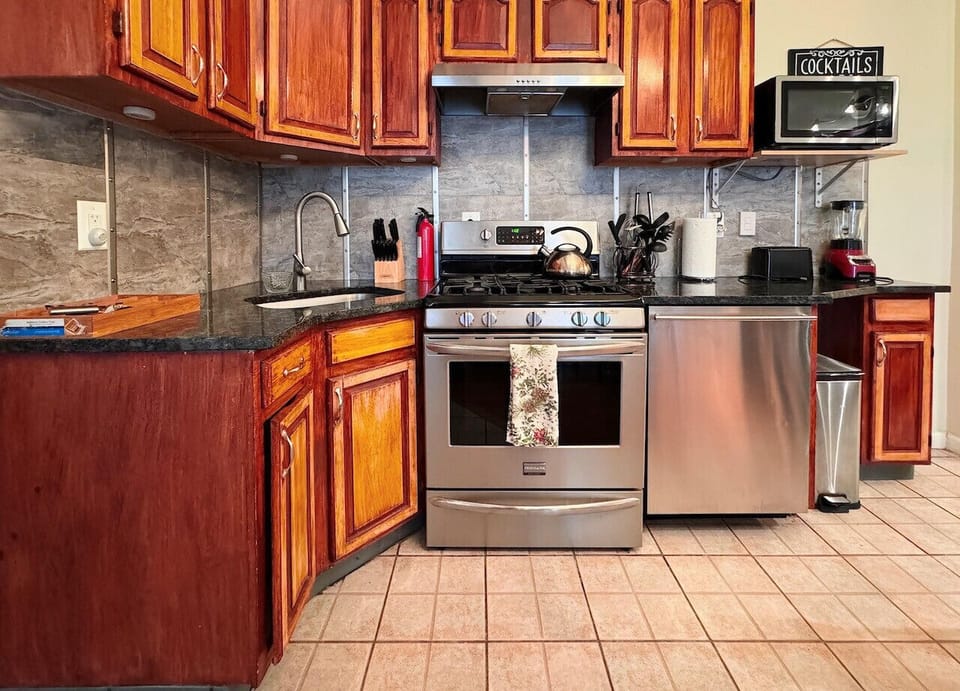Full kitchen, Blender, toaster, regular coffee, maker, microwave, silverware, can opener, cups, plates, pans, etc.