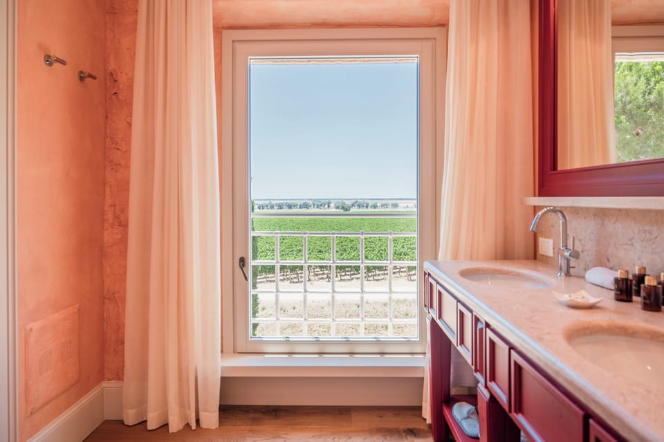 Deluxe Room, Garden View (Granaio) | Minibar, in-room safe, desk, laptop workspace