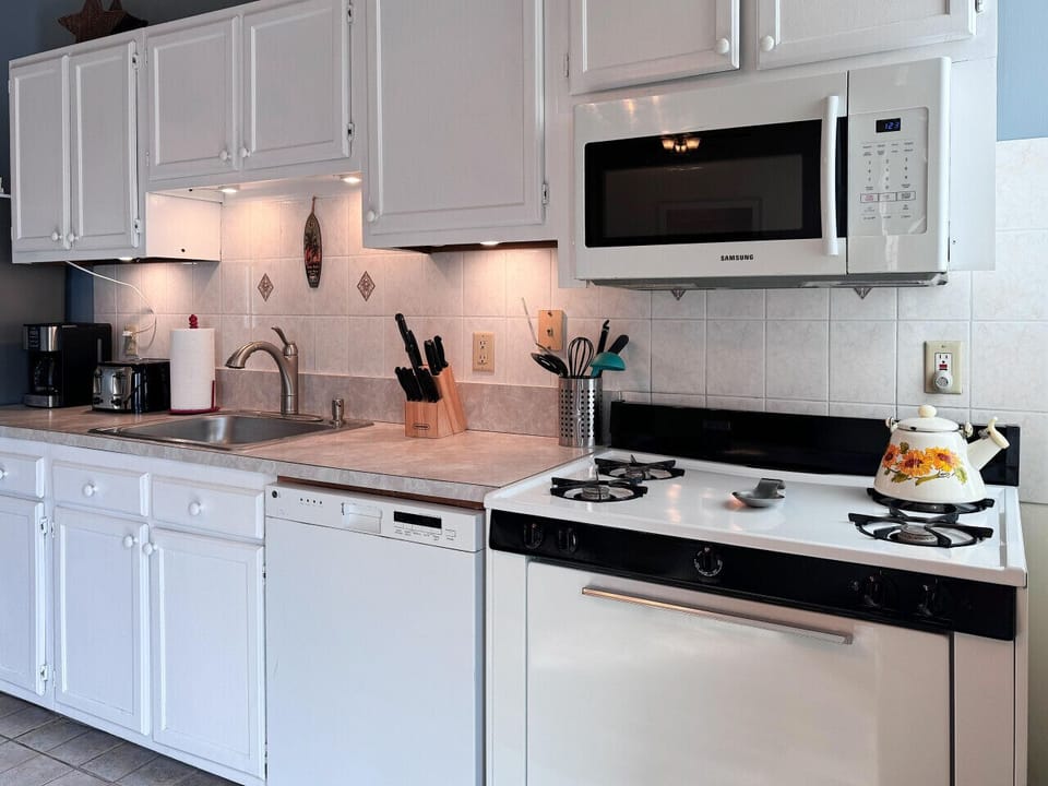Full kitchen, blender, toaster, can opener, regular coffee, maker, silverware, microwave, fridge, etc.