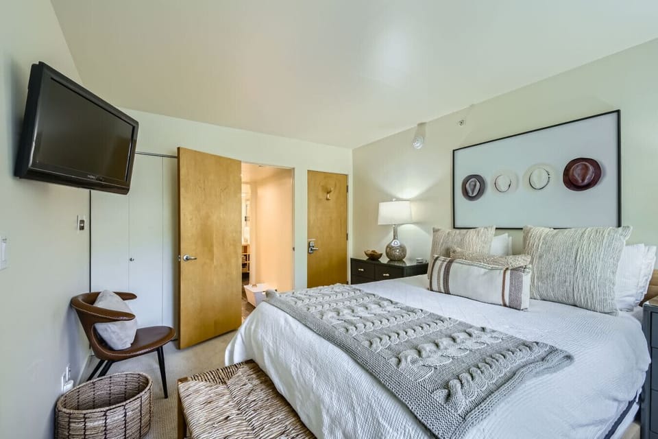 Sink into your master bedroom with plenty of pillows and extra blankets for ultimate comfort. Closet space for all your clothes, with convenient bathroom access. Everything arranged for restful nights in your Vail retreat
