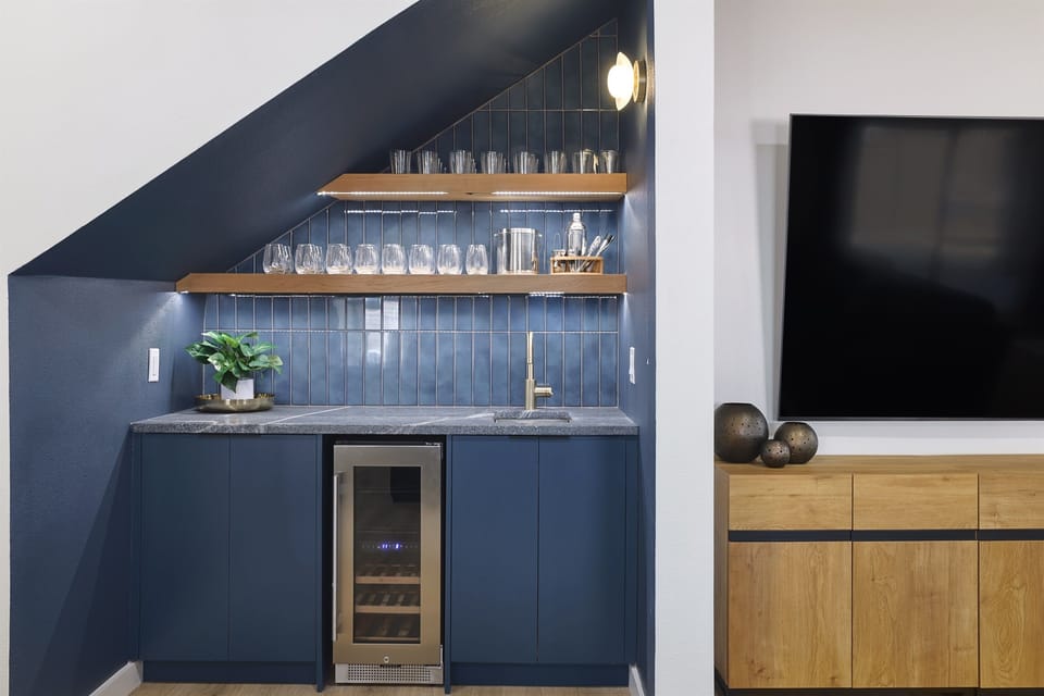 Fix yourself a drink at the wet bar during a fun family evening.