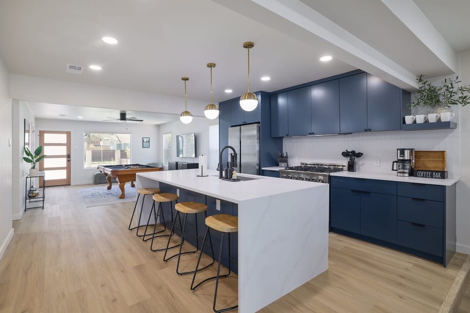 Reserve your seat at the vast kitchen island and enjoy watching the cooking show.