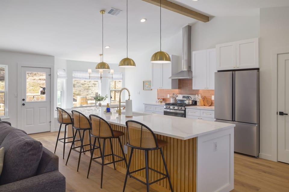 Fully stocked kitchen with oversized kitchen island.