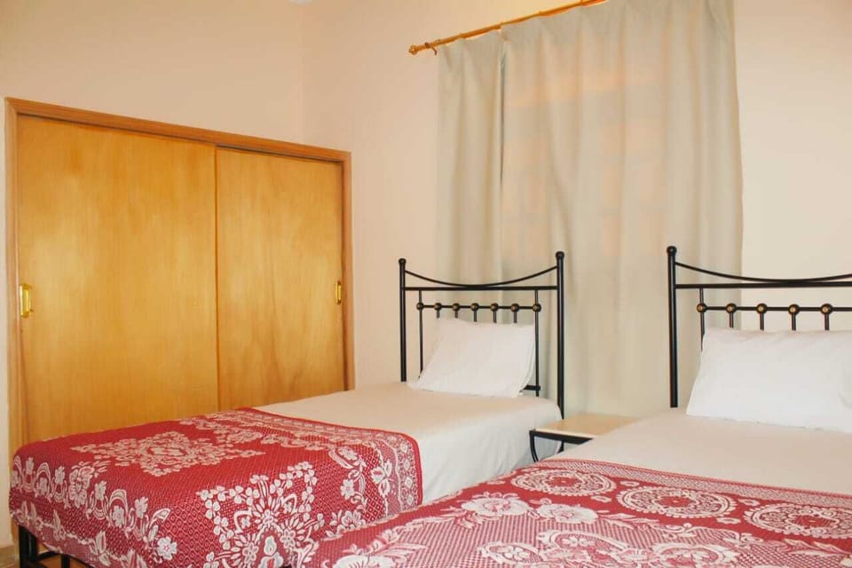 Apartment, 2 Bedrooms | Desk, laptop workspace, blackout drapes, free WiFi