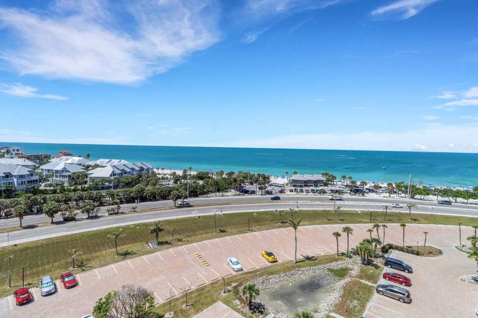 You park for free at Bonita Beach & Tennis Club and then easily walk across Hickory Boulevard to the beach access in front of building 1.