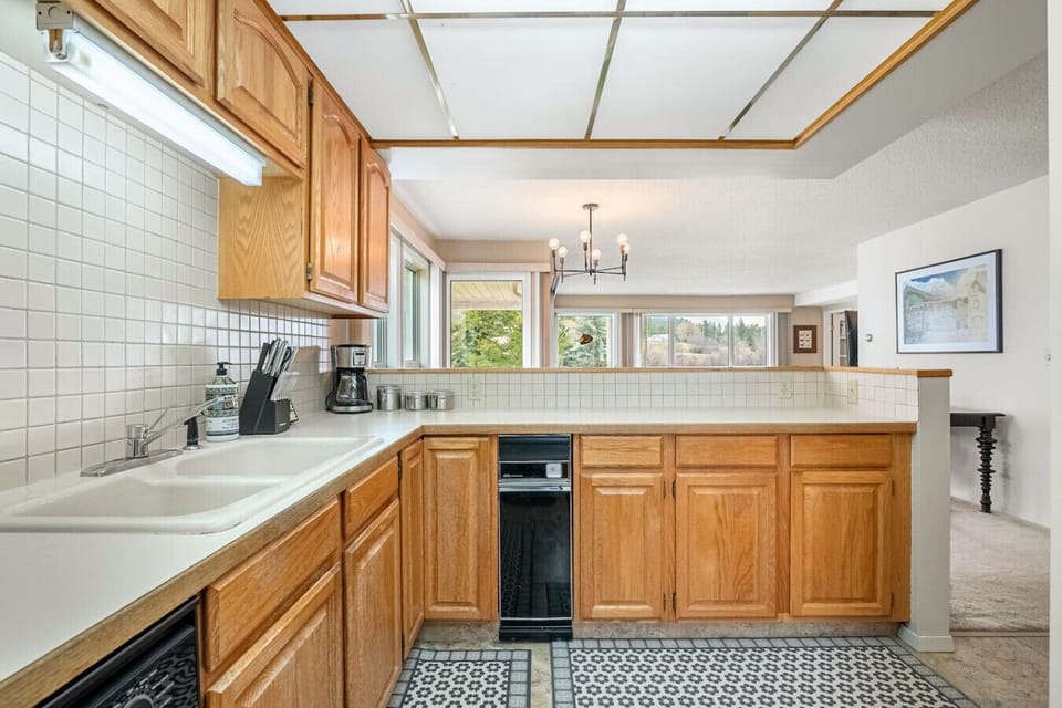 Full kitchen with a blender, crockpot/slow cooker, drip coffee machine, ground coffee, tea & sugar.