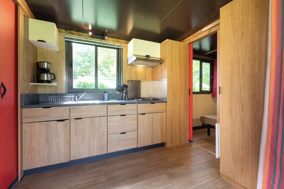 Cottage | Private kitchen | Stovetop, highchair, cookware/dishes/utensils, cleaning supplies
