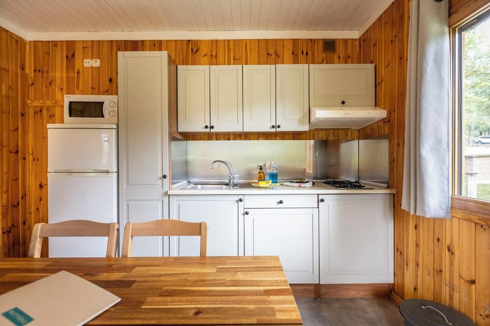 Chalet | Private kitchen | Stovetop, highchair, cookware/dishes/utensils, cleaning supplies