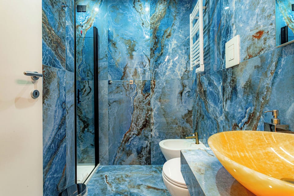 Shower, hair dryer, slippers, towels