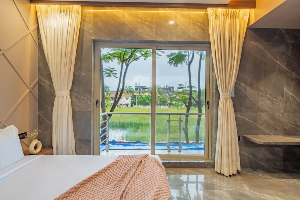 Family Room, Balcony, City View | Blackout drapes, iron/ironing board, free WiFi