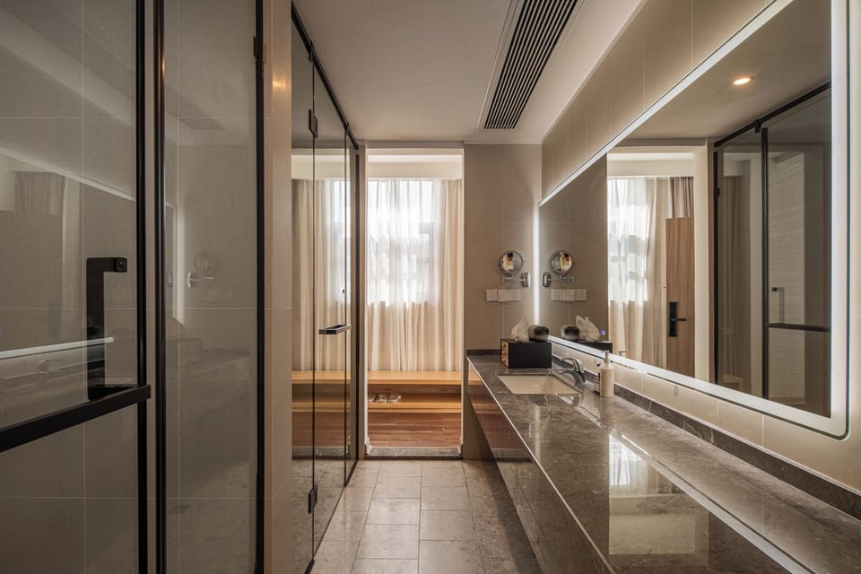 Grand Double Room, Balcony, Mountain View | Bathroom | Separate tub and shower, jetted tub, rainfall showerhead, hair dryer