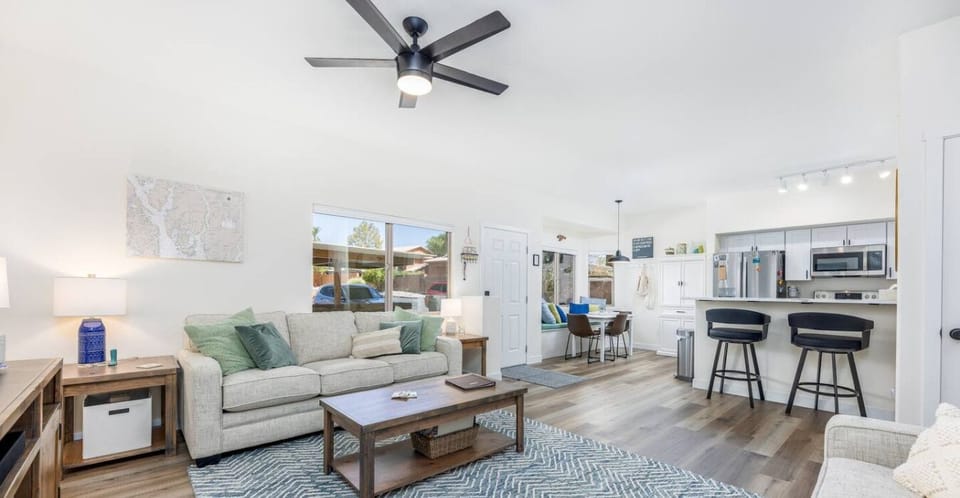 Unwind in the spacious, light-filled living room, perfect for gathering with loved ones in the open layout. End your day with a movie or a fun-filled game night in this cozy and inviting space