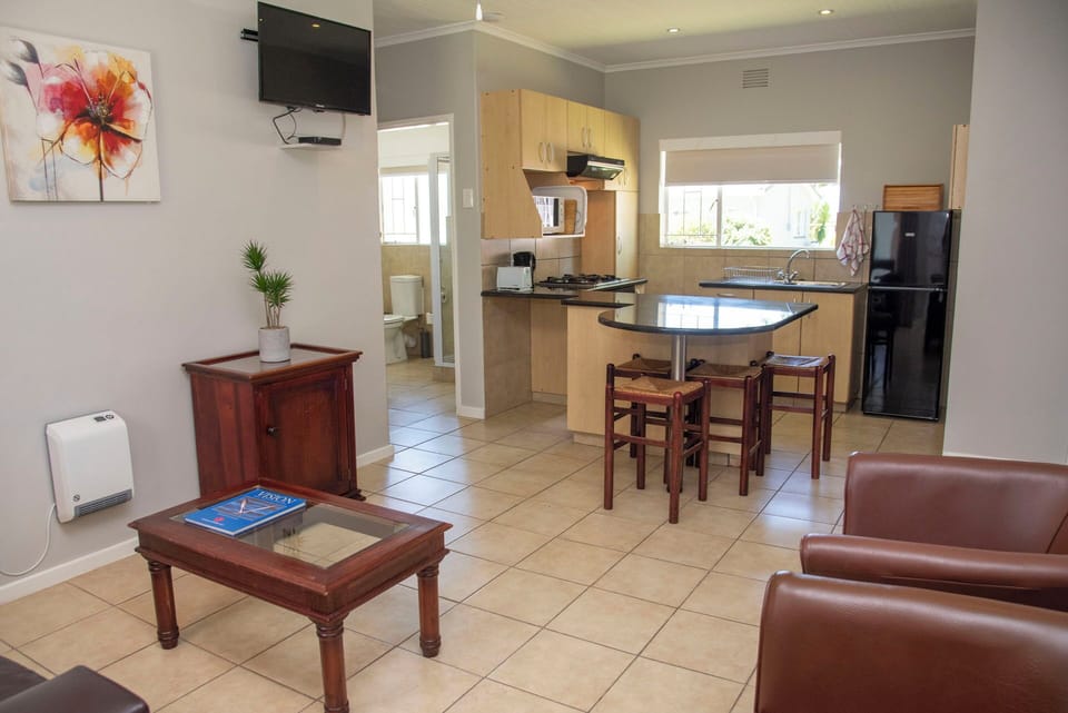 Family Chalet, Garden View | Living area | 32-inch TV with satellite channels