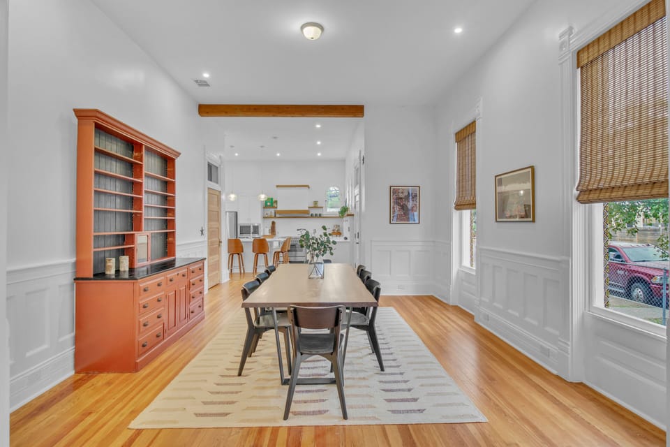 Spacious dining room seating for 8. Walnut slab table is beautiful