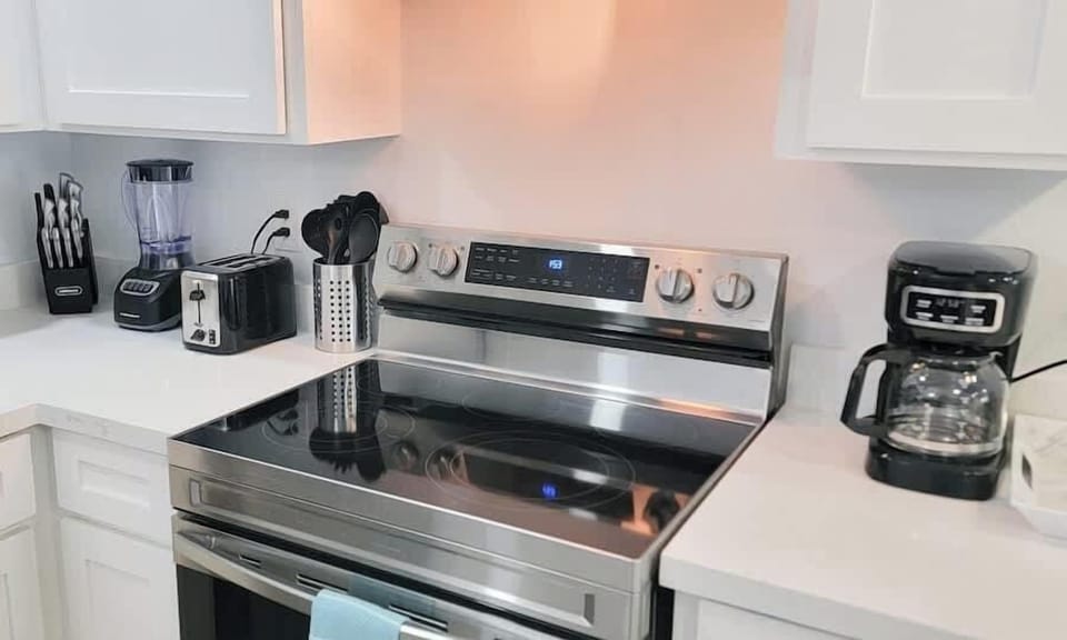 A clean, well‑kept kitchen corner with simple lines and bright light that creates an easy, welcoming feel. The organized layout brings a calm rhythm to the space, making it a comfortable spot to ease into your day at a relaxed, steady pace.