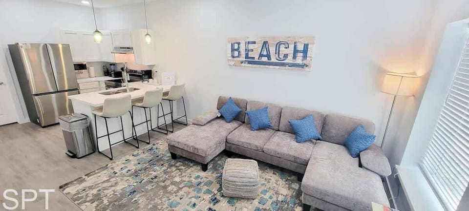 A bright, welcoming space where soft coastal notes and clean lines create an easy, relaxed flow. The open layout and gentle tones bring a steady sense of comfort, offering a naturally calming place to unwind and settle into your stay.