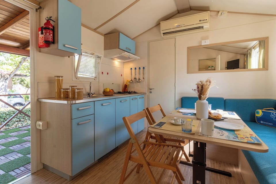 Standard Mobile Home, Pets Allowed | Private kitchen | Stovetop, cookware/dishes/utensils, dining tables, kitchen islands