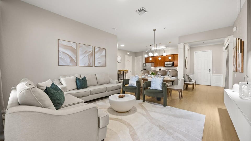 Contemporary living room with sectional seating and natural light