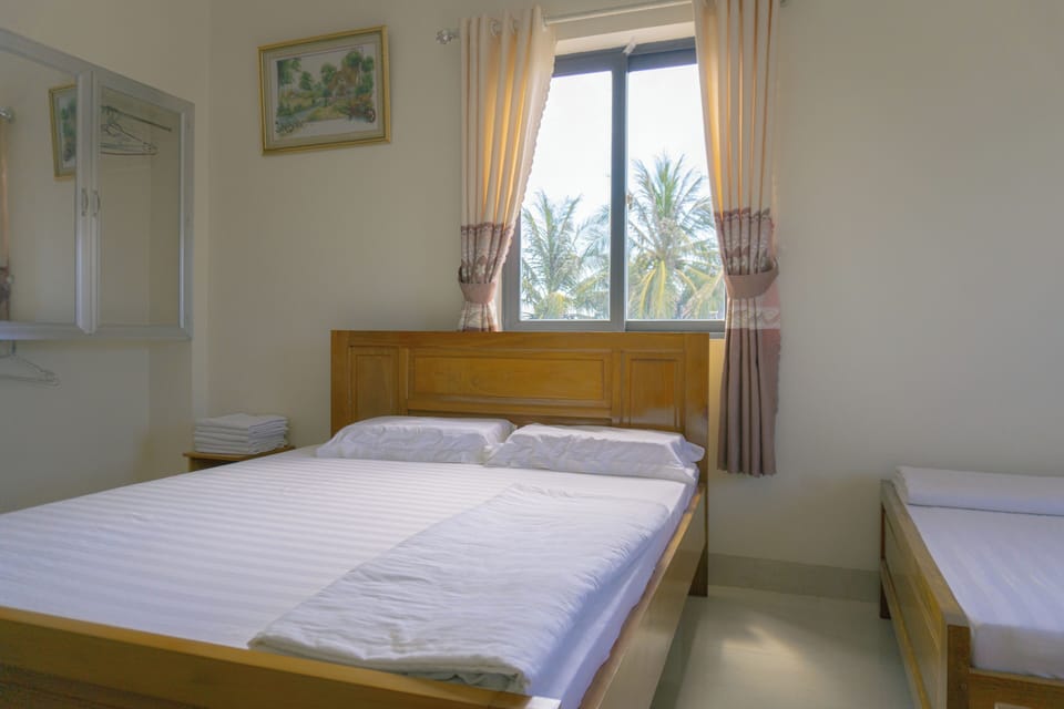 Triple Room, Multiple Beds, Pets Allowed | Desk, blackout drapes, soundproofing