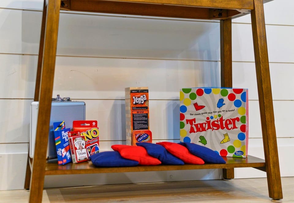 Board games galore! This cheerful nook is fully stocked for family game night, rainy day fun, or a little friendly competition.