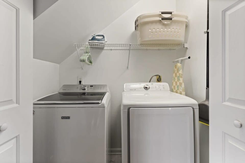 Convenient laundry area with a washer and dryer, neatly tucked away for easy access. Ideal for longer stays and everyday comfort.