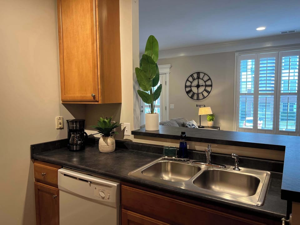 Fully equipped kitchen has bar seating for two
