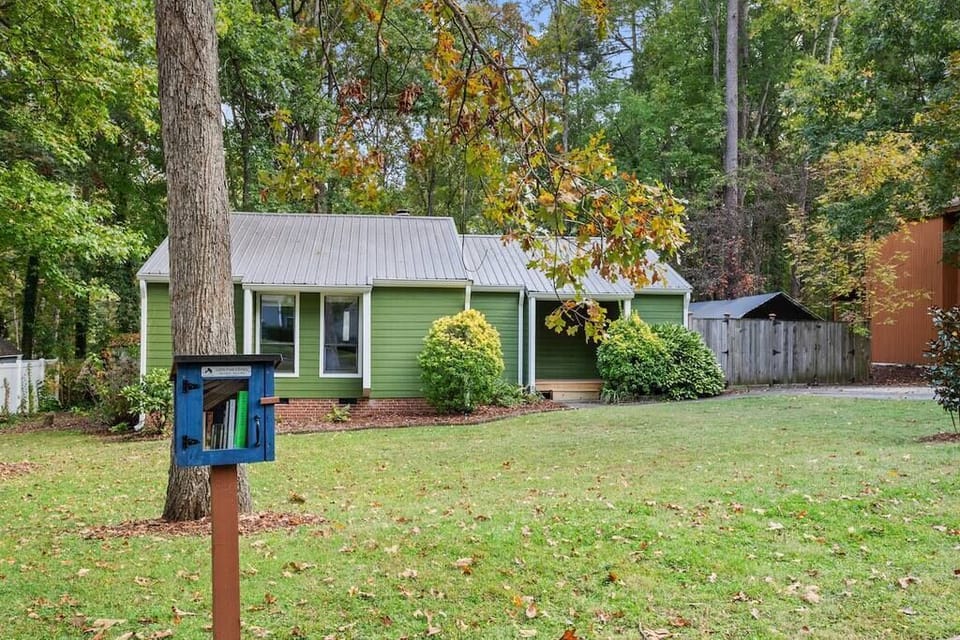 View of the front of the home, also showing the little free library!