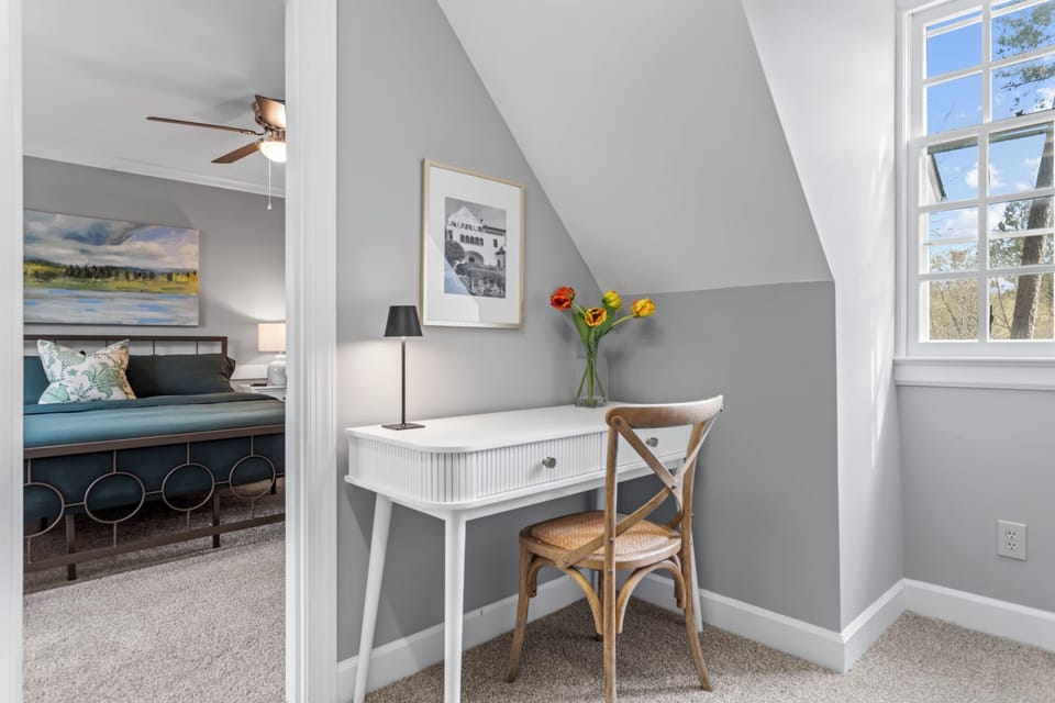 View of the second desk area, located off of the primary bedroom in the walk in closet.